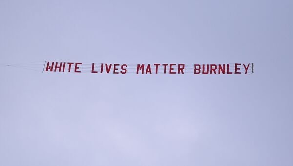 Soccer Football - Premier League - Manchester City v Burnley - Etihad Stadium, Manchester, Britain - June 22, 2020 A White Lives Matter Burnley banner is seen tied to a plane above the stadium, as play resumes behind closed doors following the outbreak of the coronavirus disease (COVID-19) - Sputnik International