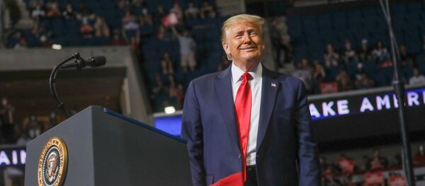 U.S. President Donald Trump smiles at the crowd as he arrives at the podium to speak during his first re-election campaign rally in several months in the midst of the coronavirus disease (COVID-19) outbreak, at the BOK Center in Tulsa, Oklahoma, U.S., June 20, 2020 - Sputnik International