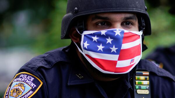 A police officer looks on during events to mark Juneteenth, which commemorates the end of slavery in Texas, two years after the 1863 Emancipation Proclamation freed slaves elsewhere in the United States, amid nationwide protests against racial inequality, in New York City, New York, U.S., June 19, 2020 - Sputnik International