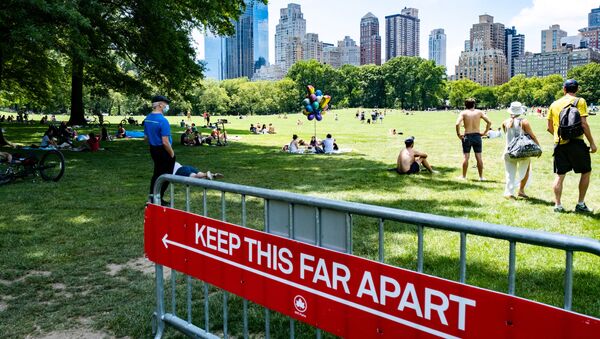 People enjoy the weather in Central Park, the day before the city starts phase two of reopening after the lockdown due to the coronavirus disease (COVID-19), in the Manhattan borough of New York City, U.S., June 21, 2020. - Sputnik International