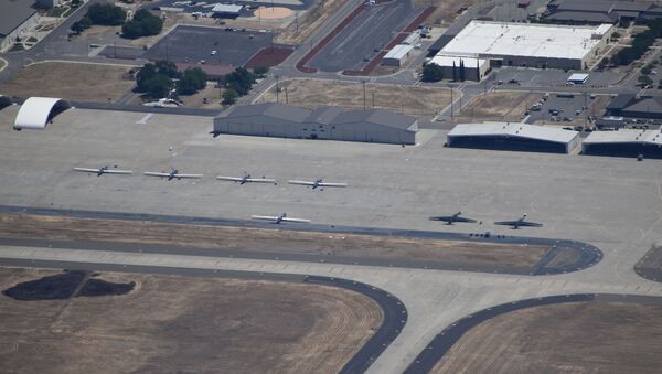RQ-4 Global Hawk drones and U-2 Dragon Lady spy planes sit on the tarmac at Beale Air Force Base, California - Sputnik International