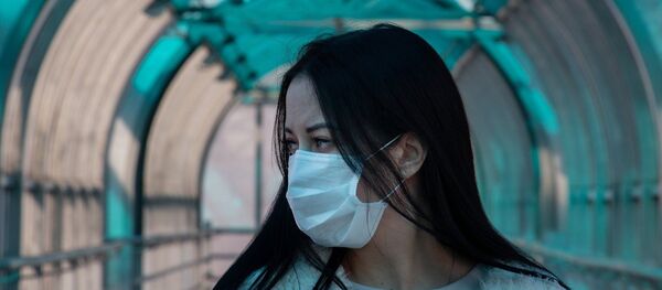 Asian woman wearing a mask Asian woman wearing a mask - Sputnik International