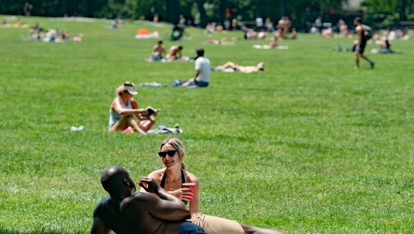 People enjoy the weather in Central Park, the day before the city starts phase two of reopening after the lockdown due to the coronavirus disease (COVID-19), in the Manhattan borough of New York City, U.S., June 21, 2020 - Sputnik International