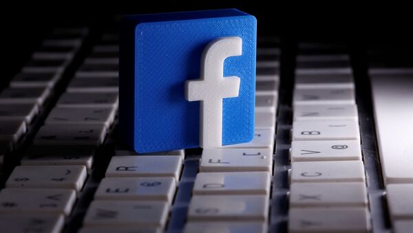  A 3D-printed Facebook logo is seen placed on a keyboard in this illustration taken March 25, 2020 - Sputnik International