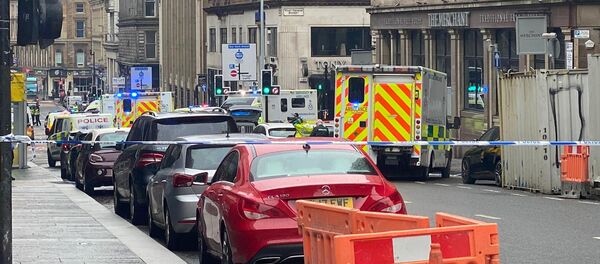 Emergency respoders are seen near a scene of reported stabbings, in Glasgow, Scotland, Britain June 26, 2020, in this picture obtained from social media - Sputnik International