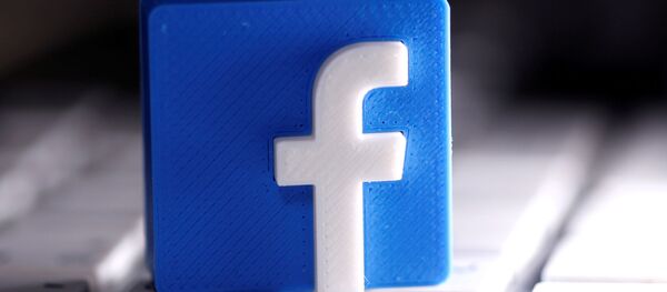 A 3D-printed Facebook logo is seen placed on a keyboard in this illustration taken March 25, 2020. A 3D-printed Facebook logo is seen placed on a keyboard in this illustration taken March 25, 2020. - Sputnik International