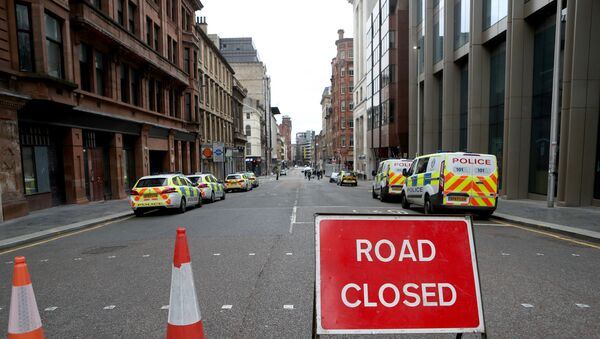 Police vehicles are seen parked near the scene of reported multiple stabbings at West George Street in Glasgow, Scotland, Britain June 27, 2020. - Sputnik International
