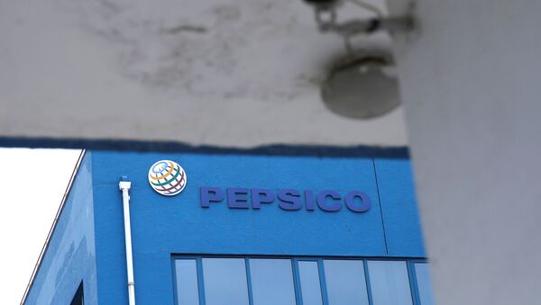 A Pepsico sign is seen at its food-processing plant near a surveillance camera in Beijing's Daxing district, following a new outbreak of the coronavirus disease (COVID-19), China June 22, 2020. - Sputnik International