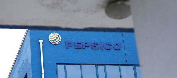 A Pepsico sign is seen at its food-processing plant near a surveillance camera in Beijing's Daxing district, following a new outbreak of the coronavirus disease (COVID-19), China June 22, 2020. - Sputnik International