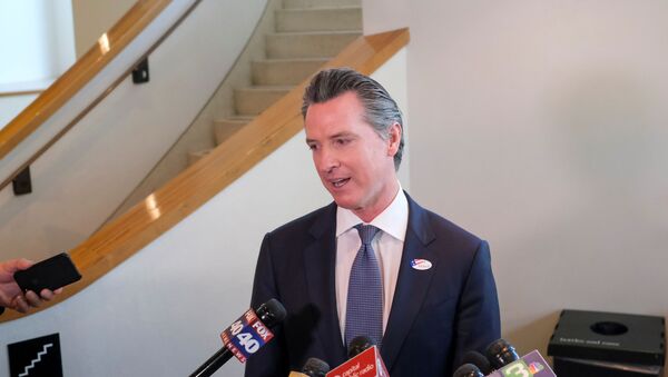 California's Governor Gavin Newsom speaks to the media after casting his vote at a voting center at The California Museum for the presidential primaries on Super Tuesday in Sacramento, CA, U.S., March 3, 2020. - Sputnik International