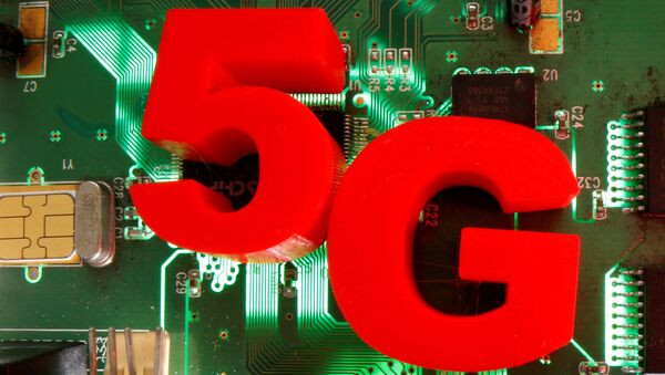 3D-printed objects representing 5G are put on a motherboard in this picture illustration taken April 24, 2020 - Sputnik International