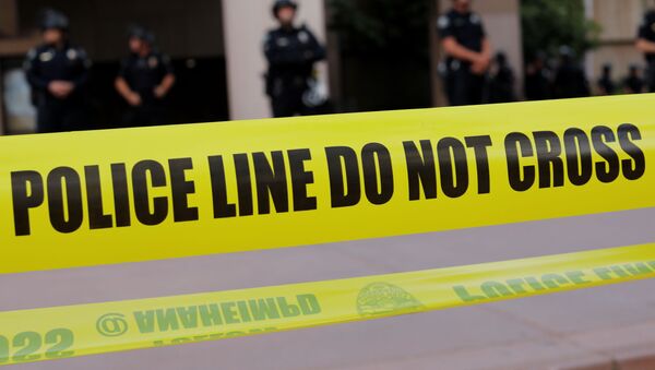 Law enforcement officers are seen behind police tape during a demonstration against the death in Minneapolis police custody of George Floyd, in Anaheim, California, U.S., June 1, 2020. - Sputnik International