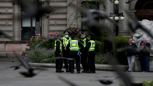 Police officers stand at George Square in Glasgow, Scotland, Britain June 27, 2020 - Sputnik International