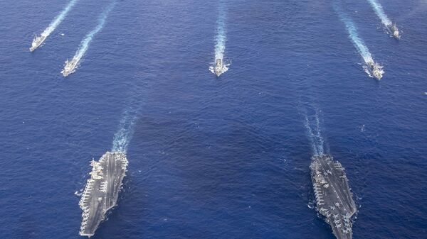 The Theodore Roosevelt Carrier Strike Group transits in formation with the Nimitz Carrier Strike Group while conducting dual carrier and airwing operations in the Philippine Sea June 23, 2020. - Sputnik International