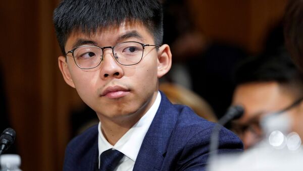  Joshua Wong, secretary-general of Hong Kong's pro-democracy Demosisto party and leader of the Umbrella Movement, listens to testimony at a Congressional-Executive Commission on China (CECC) hearing on Capitol Hill in Washington, U.S., September 17, 2019 - Sputnik International