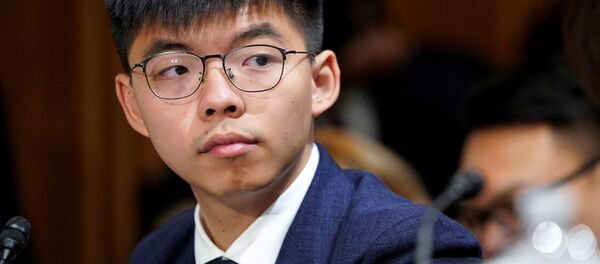 Joshua Wong, secretary-general of Hong Kong's pro-democracy Demosisto party and leader of the Umbrella Movement, listens to testimony at a Congressional-Executive Commission on China (CECC) hearing on Capitol Hill in Washington, U.S., September 17, 2019 Joshua Wong, secretary-general of Hong Kong's pro-democracy Demosisto party and leader of the Umbrella Movement, listens to testimony at a Congressional-Executive Commission on China (CECC) hearing on Capitol Hill in Washington, U.S., September 17, 2019 - Sputnik International