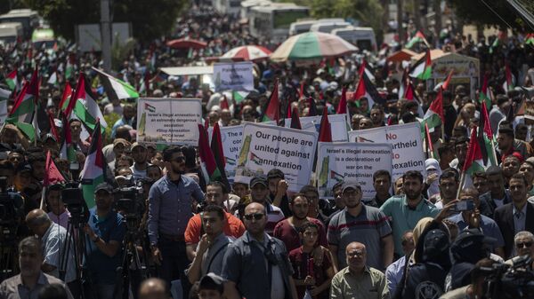 Palestinians demonstrate against Israeli plans for the annexation of parts of the West Bank, in Gaza City, Wednesday, July 1, 2020. - Sputnik International