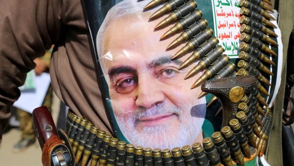 A supporter of the Houthis has a poster attached to his waist of Iranian Major-General Qassem Soleimani, head of the elite Quds Force, who was killed in an air strike at Baghdad airport, during a rally to denounce the U.S. killing, in Saada, Yemen January 6, 2020 - Sputnik International