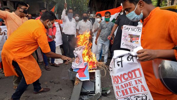 FILE PHOTO: Supporters of India's ruling Bharatiya Janata Party (BJP) burn an effigy depicting Chinese President Xi Jinping during a protest against China, in Kolkata, India, June 19, 2020 - Sputnik International