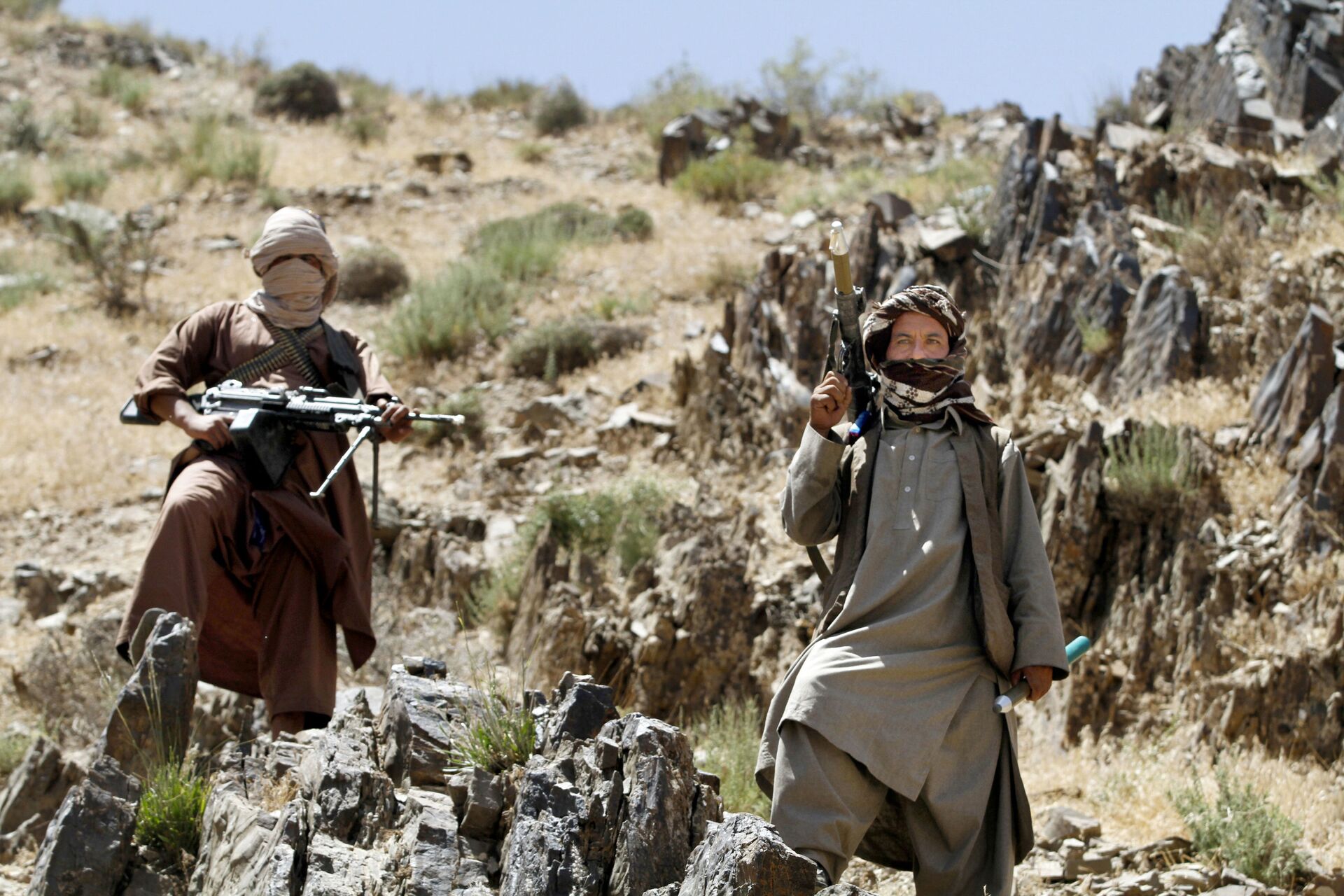 In this Friday, May 27, 2016 photo, Taliban fighters stand guard as senior leader of a breakaway faction of the Taliban Mullah Abdul Manan Niazi, not pictured, delivers a speech to his fighters, in Shindand district of Herat province, Afghanistan - Sputnik International, 1920, 07.09.2021