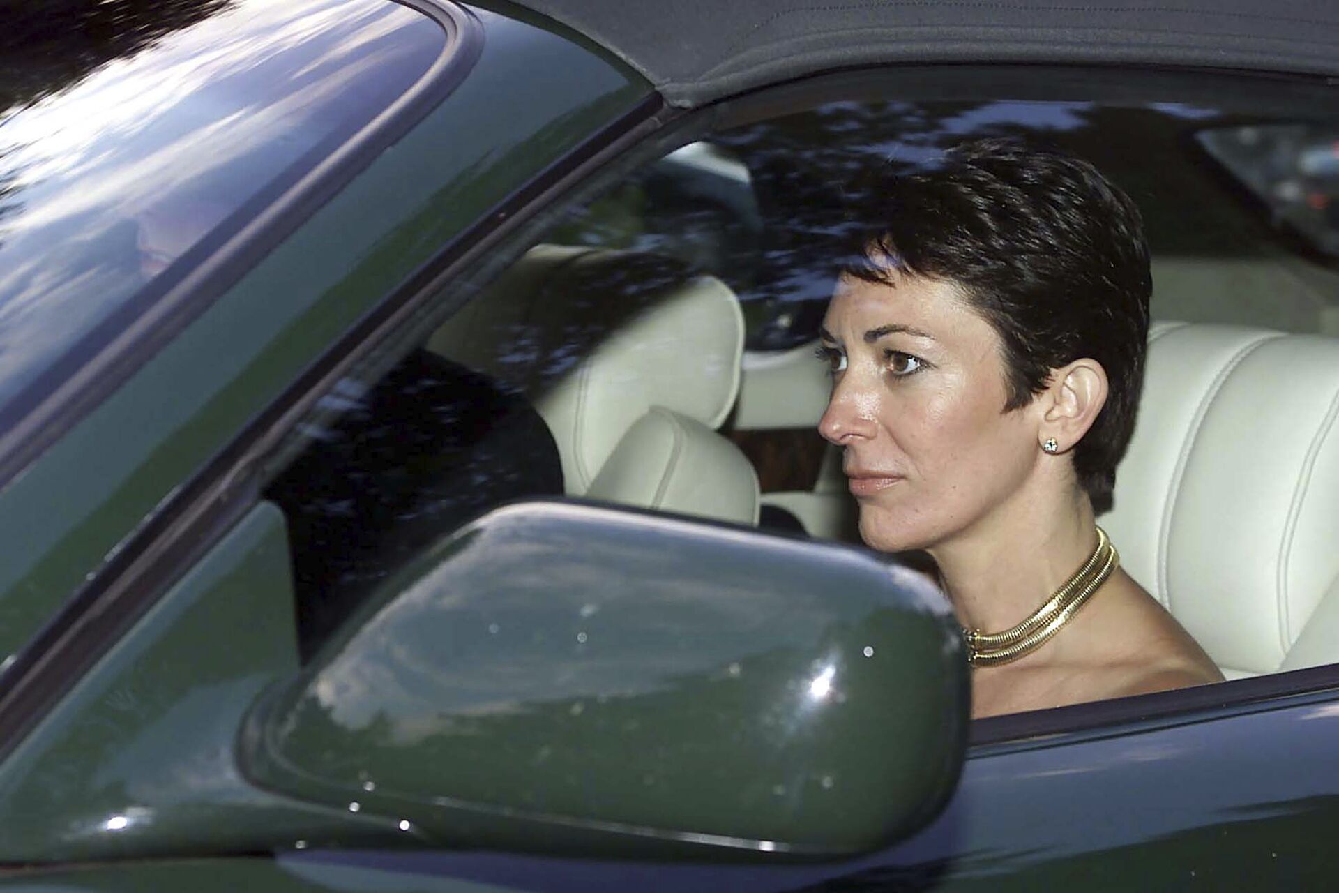 FILE - In this Sept. 2, 2000 file photo, British socialite Ghislaine Maxwell, driven by Britain's Prince Andrew leaves the wedding of a former girlfriend of the prince, Aurelia Cecil, at the Parish Church of St Michael in Compton Chamberlayne near Salisbury, England. The FBI said Thursday July 2, 2020, Ghislaine Maxwell, who was accused by many women of helping procure underage sex partners for Jeffrey Epstein, has been arrested in New Hampshire. - Sputnik International, 1920, 07.09.2021