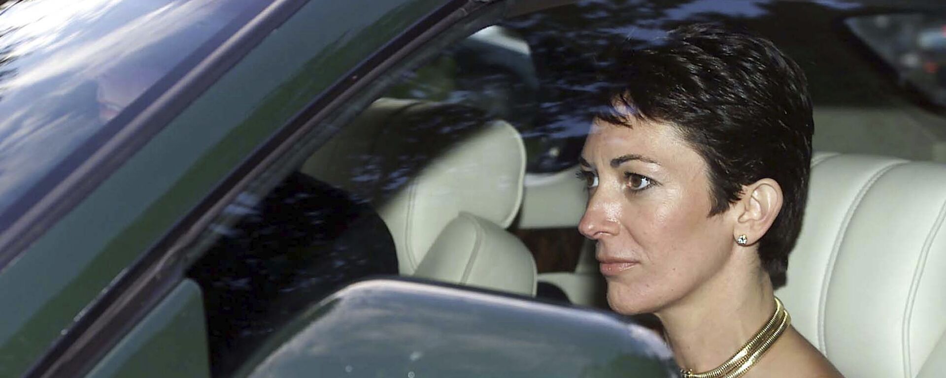 FILE - In this Sept. 2, 2000 file photo, British socialite Ghislaine Maxwell, driven by Britain's Prince Andrew leaves the wedding of a former girlfriend of the prince, Aurelia Cecil, at the Parish Church of St Michael in Compton Chamberlayne near Salisbury, England. The FBI said Thursday July 2, 2020, Ghislaine Maxwell, who was accused by many women of helping procure underage sex partners for Jeffrey Epstein, has been arrested in New Hampshire. - Sputnik International, 1920, 26.06.2022