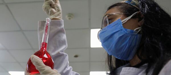A pharmacist doctor works on the basics of the raw materials for investigational of the coronavirus disease (COVID-19) treatment drug Remdesivir, in Ibn Sina laboratory, at Eva Pharma Facility in Cairo, Egypt 25 June 2020. - Sputnik International