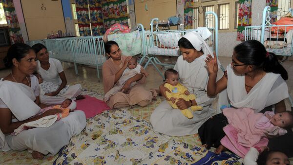 Orphaned Indian baby girls are cared for by nuns and staff at The Matruchhaya Orphanage which is run by The Sisters of Charity of St. Anne Trust in Nadiad some 60kms. from Ahmedabad on October 29, 2011 - Sputnik International