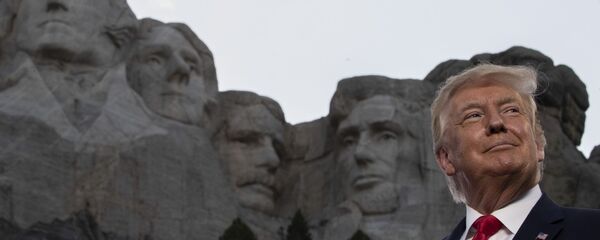 President Donald Trump smiles at Mount Rushmore National Memorial, Friday, July 3, 2020, near Keystone, S.D. (AP Photo/Alex Brandon) - Sputnik International