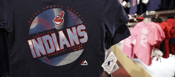 A kids shirt with the Chief Wahoo logo hangs at the Cleveland Indians team shop, Monday, Jan. 29, 2018, in Cleveland. Divisive and hotly debated, the Chief Wahoo logo is being removed from the Cleveland Indians' uniform next year.  - Sputnik International