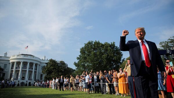 U.S. President Donald Trump thrusts his fist as he arrives on the White House South Lawn to host a 4th of July 2020 Salute to America to celebrate the U.S. Independence Day holiday at the White House in Washington, U.S., July 4, 2020 - Sputnik International