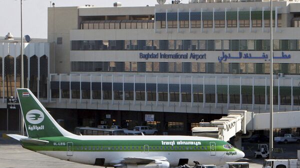 In this Dec. 28, 2005 file photo, an Iraqi Airways plane sits on the tarmac at Baghdad International Airport. European and Dubai-based airlines have begun rerouting flights over Iraqi airspace as a security precaution, though Iraq says its skies are safe - Sputnik International