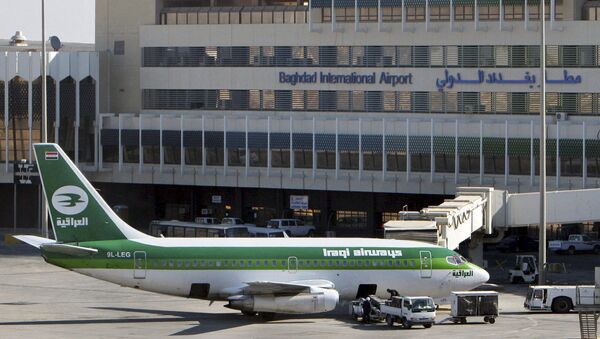 In this Dec. 28, 2005 file photo, an Iraqi Airways plane sits on the tarmac at Baghdad International Airport. European and Dubai-based airlines have begun rerouting flights over Iraqi airspace as a security precaution, though Iraq says its skies are safe - Sputnik International