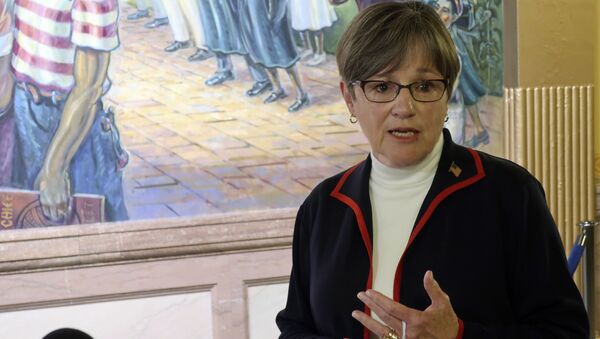 Kansas Gov. Laura Kelly answers questions from reporters about the coronavirus pandemic after a meeting with legislative leaders, Thursday, July 2, 2020, at the Statehouse in Topeka, Kan. - Sputnik International