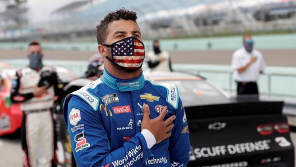 Bubba Wallace stands for the national anthem prior to the NASCAR Cup series race at Homestead-Miami Speedway - Sputnik International