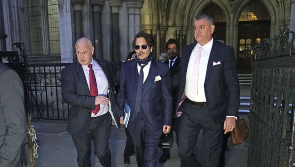 Actor Johnny Depp, centre, leaves the High Court in London, after attending a preliminary hearing in his libel case against the publishers of The Sun and its executive editor, Dan Wootton, over a 2018 article alleging he had been abusive to his ex-wife Amber Heard, 26 February 2020. - Sputnik International