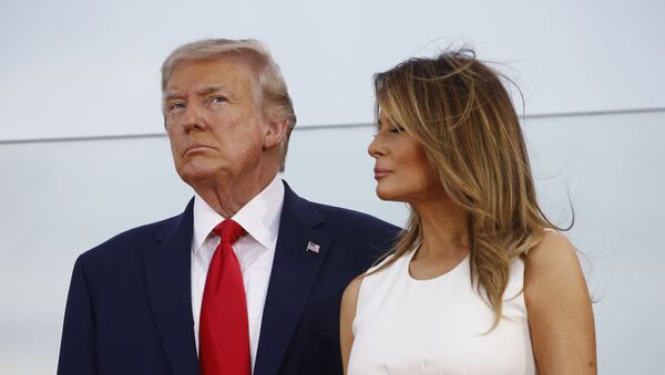 President Donald Trump and first lady Melania Trump stand onstage during a Salute to America event on the South Lawn of the White House, Saturday, July 4, 2020, in Washington - Sputnik International
