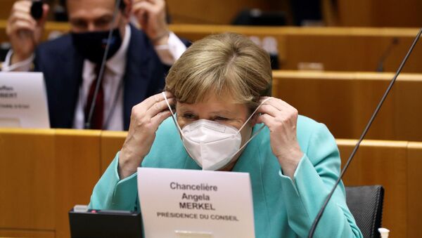 German Chancellor Angela Merkel wears a protective face mask as she attends a plenary session at the European Parliament in Brussels on July 8, 2020 upon the presentation of the German programme for EU presidency. - Sputnik International