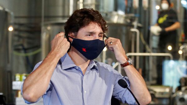 Canada's Prime Minister Justin Trudeau removes his face mask as he visits the Big Rig Brewery, which utilizes the Canada Emergency Wage Subsidy given to businesses affected by the coronavirus disease (COVID-19) outbreak, in Kanata, Ontario, Canada June 26, 2020.   - Sputnik International