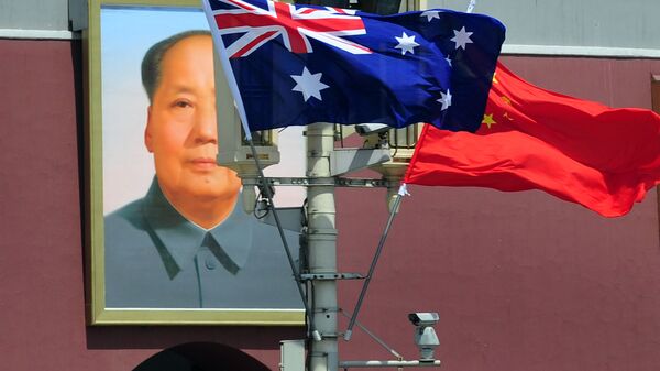The national flags of Australia and China are displayed before a portrait of Mao Zedong facing Tiananmen Square, during a visit by Australia's Prime Minister Julia Gillard in Beijing on April 26, 2011 - Sputnik International