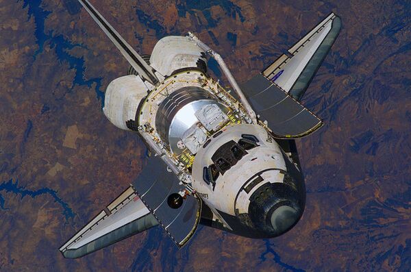 Shuttle Discovery to stay in orbit for another day - NASA - Sputnik International