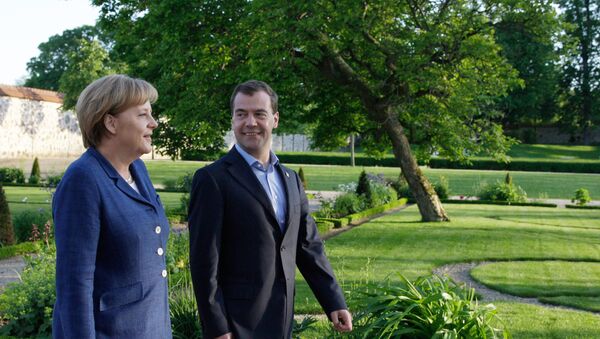 Russian Prime Minister Dmitry Medvedev and German Chancellor Angela Merkel - Sputnik International