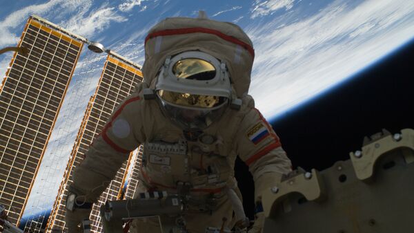 Russian cosmonaut Oleg Kotov in the open space - Sputnik International
