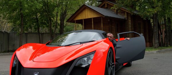 Nikolay Fomenko is seen inside a Marussia car prototype. File photo Nikolay Fomenko is seen inside a Marussia car prototype. File photo - Sputnik International