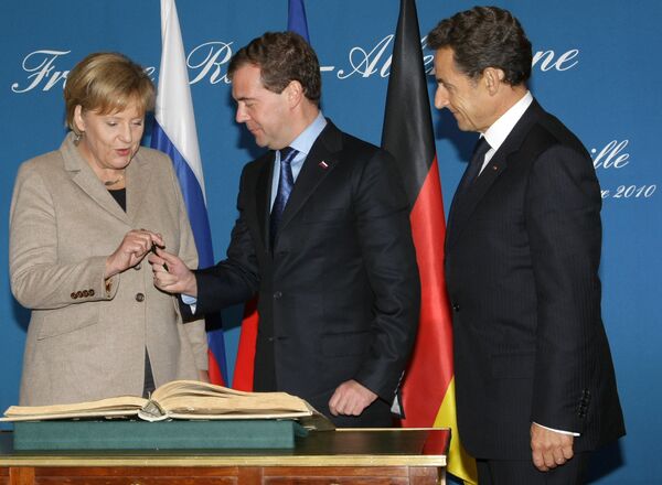 The leaders of Russia, Germany and France in Deauville - Sputnik International