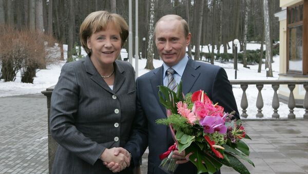 Vladimir Putin and Angela Merkel - Sputnik International