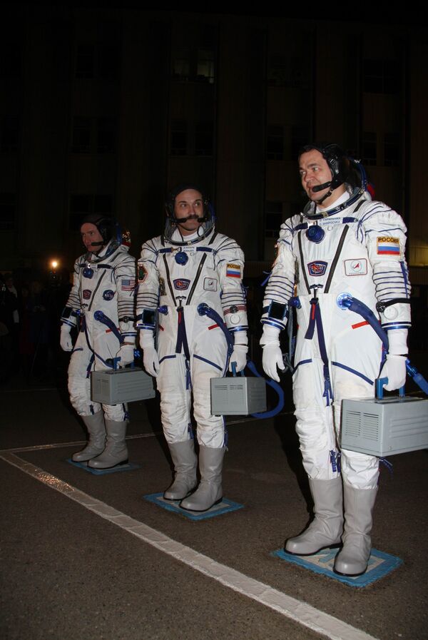 U.S. astronaut Scott Kelly, Alexander Kaleri and Oleg Skripochka. Archive - Sputnik International