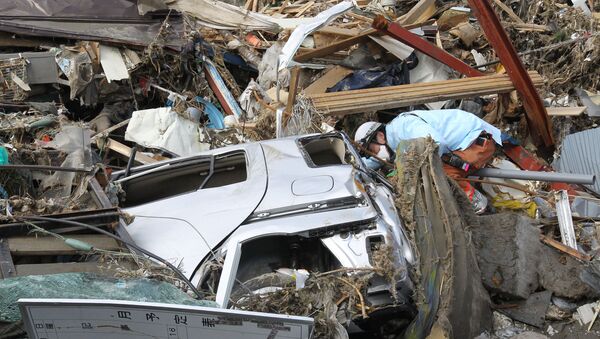 Authorities in Buddhist Japan consider burying quake victims - Sputnik International
