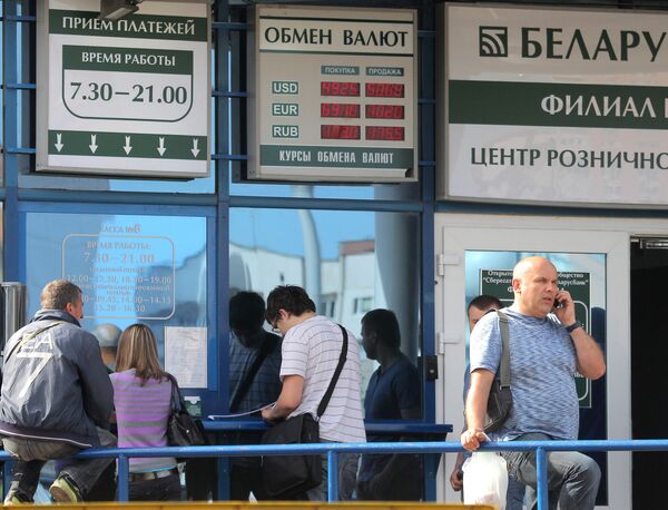 Belarus' central bank has devalued the ruble to 4,930 per dollar from 3,155, while the government has applied for a $1 billion loan from Russia and a $2 billion loan from EurAsEC - Sputnik International
