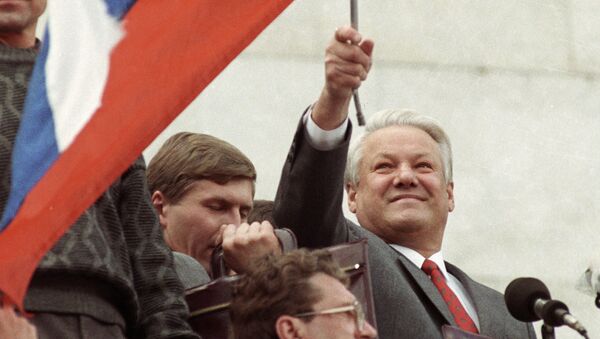 Russian President Boris Yeltsin standing on a podium with a flag - Sputnik International